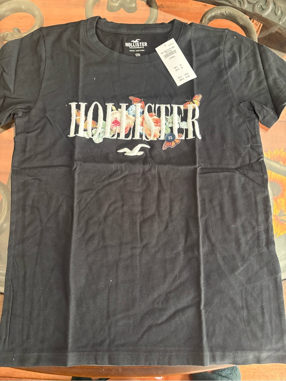 Hollister Black Tee with Floral Logo and Butterflies